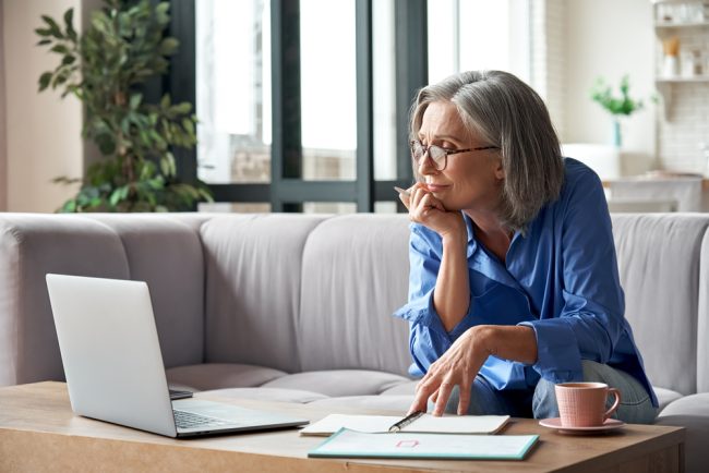 Senior,Mature,Older,Woman,Watching,Business,Training,,Online,Webinar,On